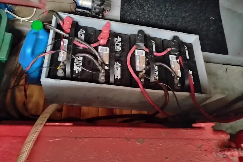 Slide: The Image of Battery compartment of a 1979 Transpac Eagle 36 Trawler with connected cables. - 47