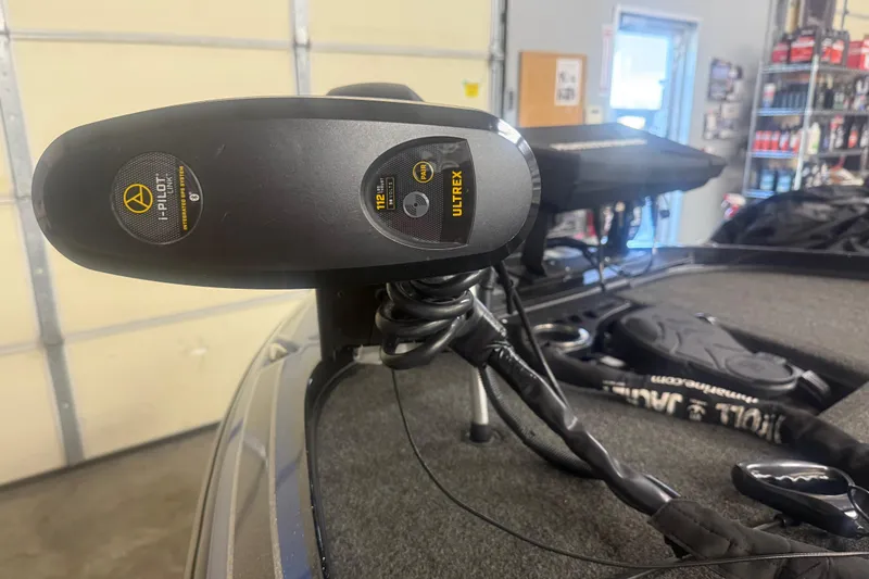 Slide: The Image of 2021 Nitro Z21 Pro boat with Minn Kota Ultrex trolling motor in a garage setting. - 7