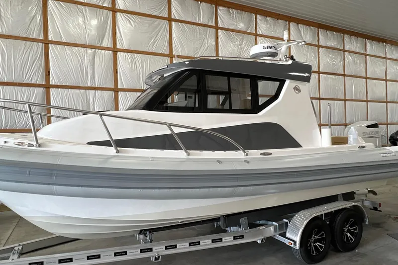 The Image of 2023 Flexboat Flex 680 Explorer in a warehouse, showcasing sleek design and modern features. - 0