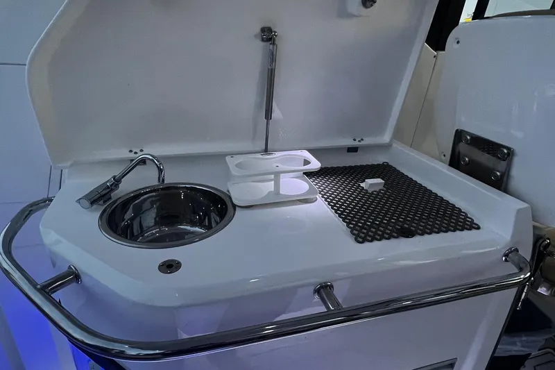 Slide: The Image of 2023 Flexboat Flex 680 Explorer interior with sink and countertop setup. - 10