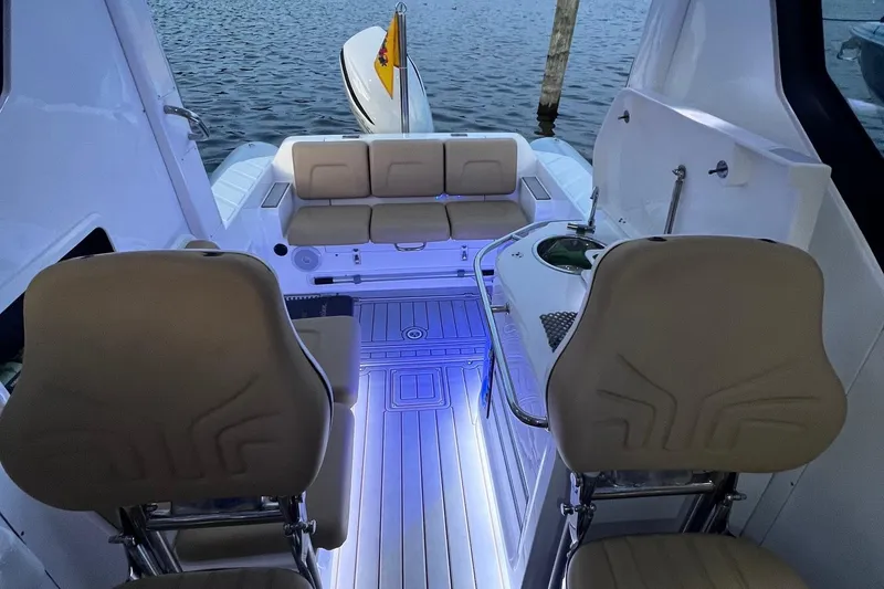 Slide: The Image of 2023 Flexboat Flex 680 Explorer interior with seating and ambient lighting. - 12