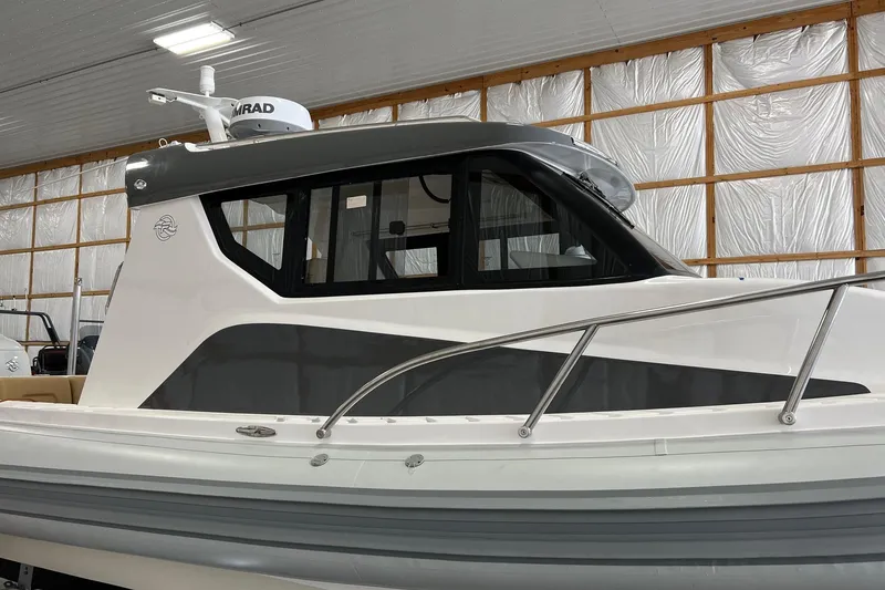 Slide: The Image of 2023 Flexboat Flex 680 Explorer in a warehouse, showcasing sleek design and modern features. - 16