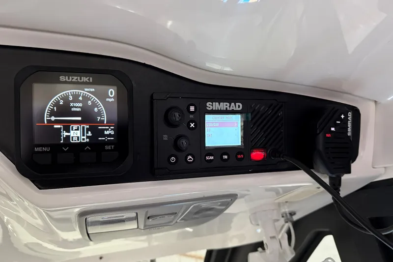 Slide: The Image of Control panel of 2023 Flexboat Flex 680 Explorer with Suzuki and Simrad displays. - 19
