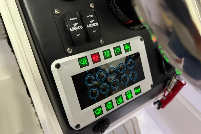 Slide: The Image of Control panel of 2023 Flexboat Flex 680 Explorer with illuminated buttons and switches. - 21