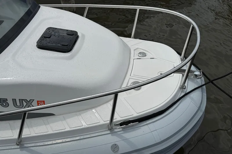 Slide: The Image of 2023 Flexboat Flex 680 Explorer bow with railing, docked on water. - 6