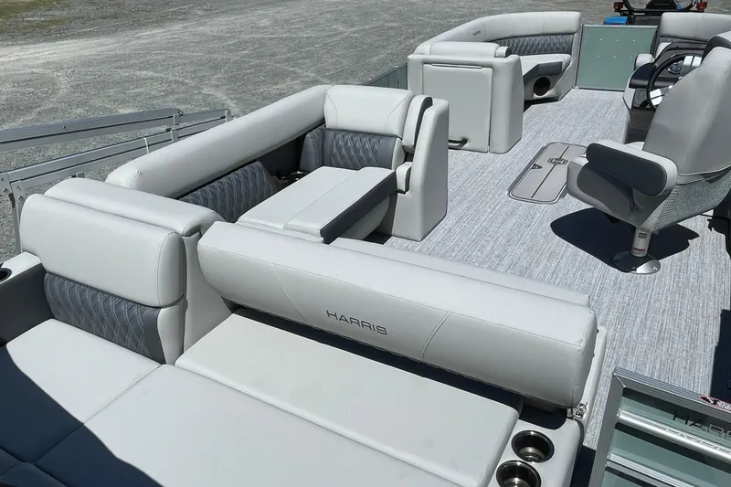 Slide: The Image of 2026 Harris Cruiser 230 pontoon boat with luxurious seating and modern design. - 10