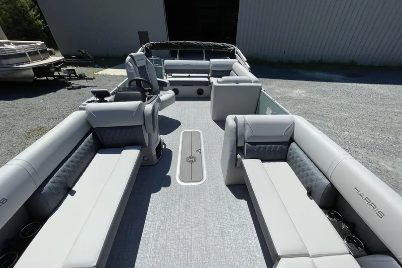 Slide: The Image of 2026 Harris Cruiser 230 pontoon boat with spacious seating and modern design. - 3