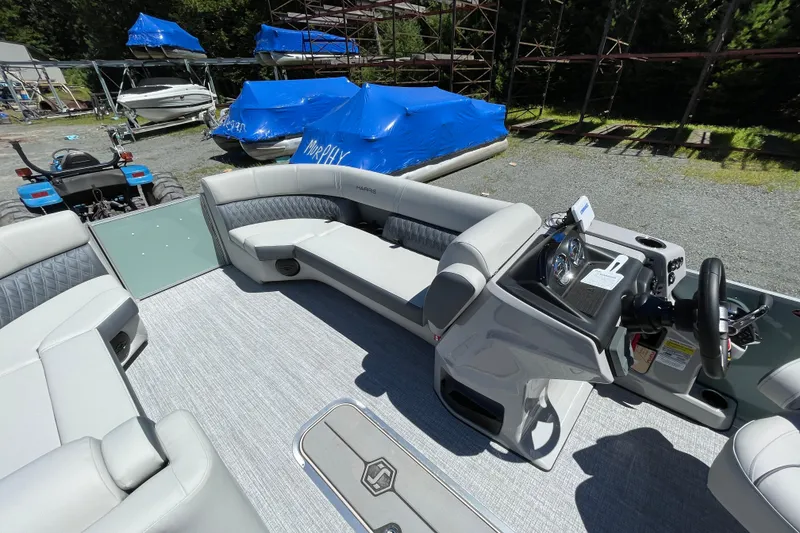 Slide: The Image of 2026 Harris Cruiser 230 pontoon boat interior with modern seating and steering console. - 6