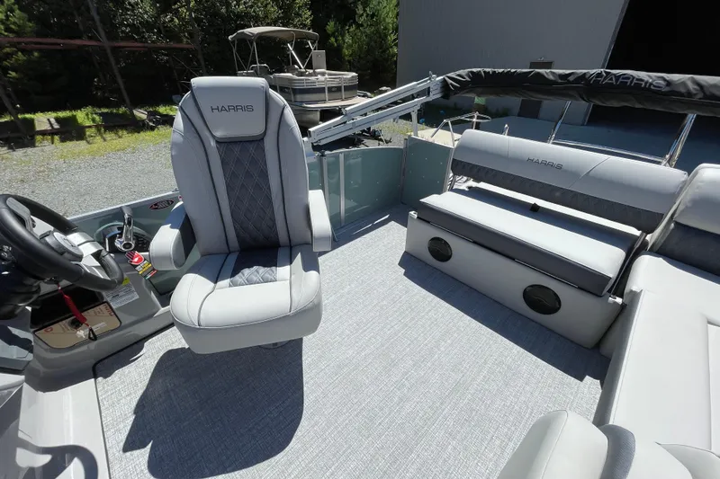 Slide: The Image of 2026 Harris Cruiser 230 boat interior with plush seating and modern design. - 7