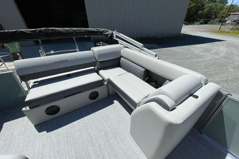 Slide: The Image of 2026 Harris Cruiser 230 boat interior with luxurious gray seating and modern design. - 8