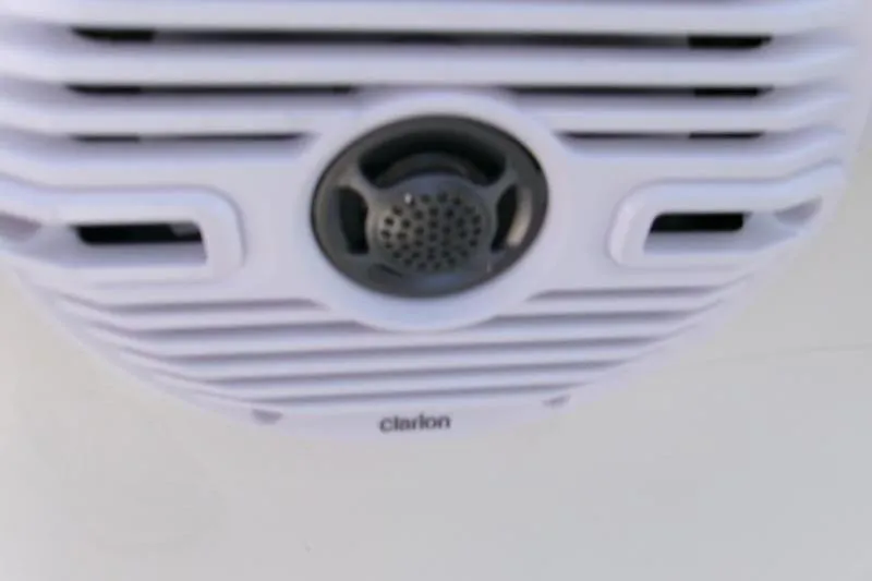 Slide: The Image of Clarion speaker on 2026 Key West 239 FS boat, featuring a sleek white design. - 10