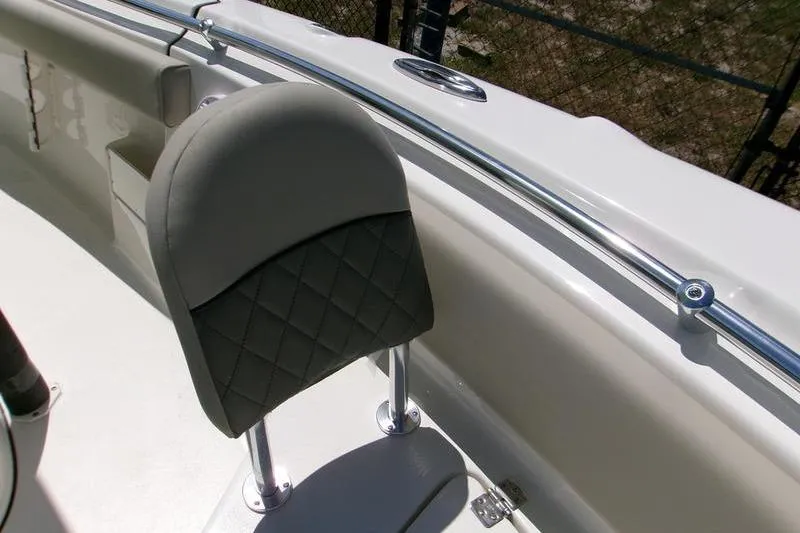 Slide: The Image of 2026 Key West 239 FS boat seat with quilted design and stainless steel railing. - 12