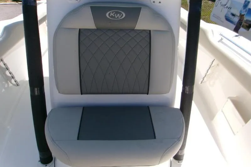 Slide: The Image of 2026 Key West 239 FS boat seat with gray diamond-pattern upholstery. - 14