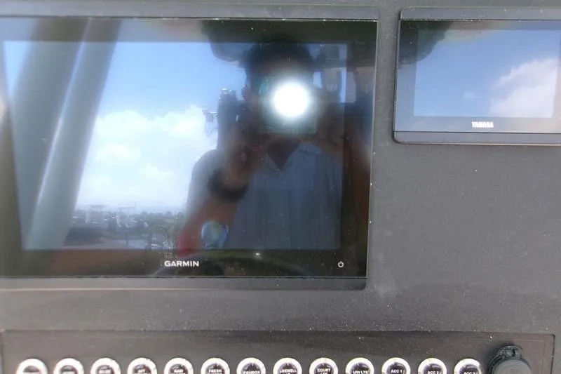 Slide: The Image of Dashboard of 2026 Key West 239 FS boat with Garmin and Yamaha displays. - 2