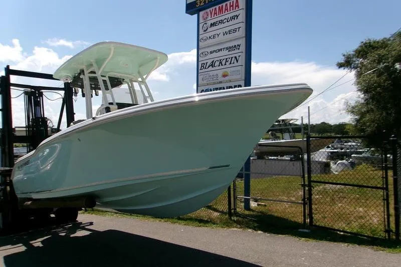 Slide: The Image of 2026 Key West 239 FS boat on forklift near dealership sign. - 8