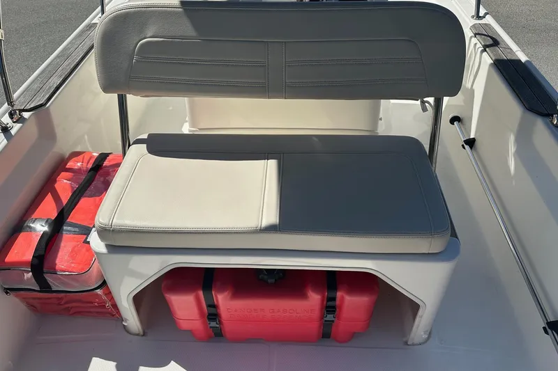 Slide: The Image of 2019 Boston Whaler 150 Montauk boat seat with storage and safety equipment. - 4