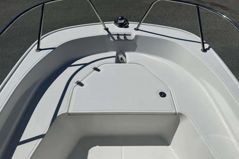 Slide: The Image of 2019 Boston Whaler 150 Montauk boat deck with stainless steel railings. - 7