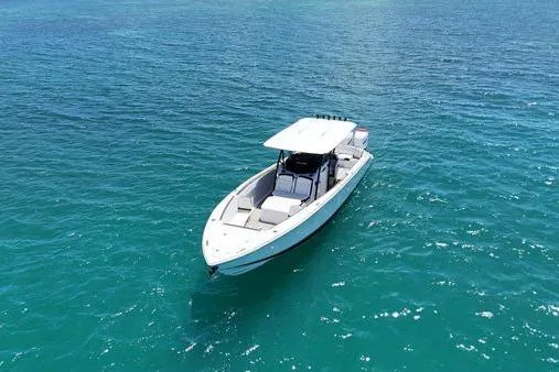 The Image of 2019 Nor-Teck 390 Sport Center Console boat on clear blue water. - 0