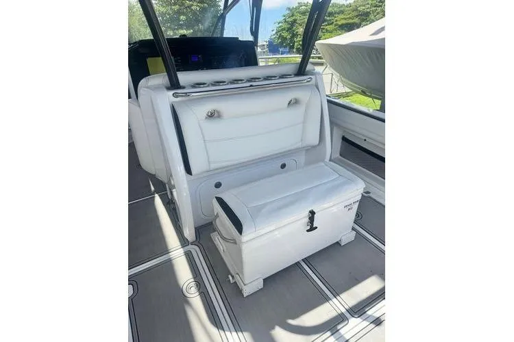 Slide: The Image of 2019 Nor-Teck 390 Sport Center Console interior with white seating and storage. - 10