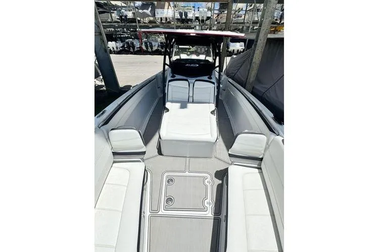Slide: The Image of 2019 Nor-Teck 390 Sport Center Console boat interior with spacious seating and sleek design. - 15