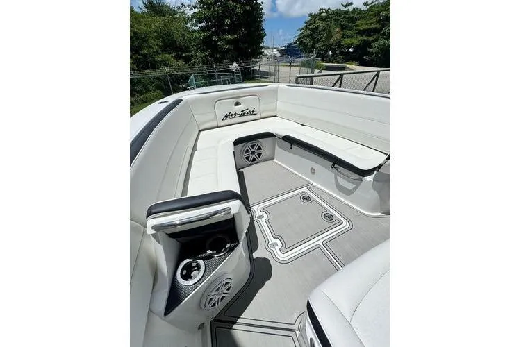 Slide: The Image of 2019 Nor-Teck 390 Sport Center Console boat interior with white seating and modern design. - 16