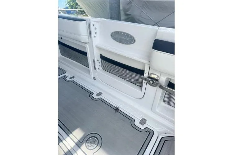 Slide: The Image of 2019 Nor-Teck 390 Sport Center Console boat interior with storage compartments and sleek design. - 17