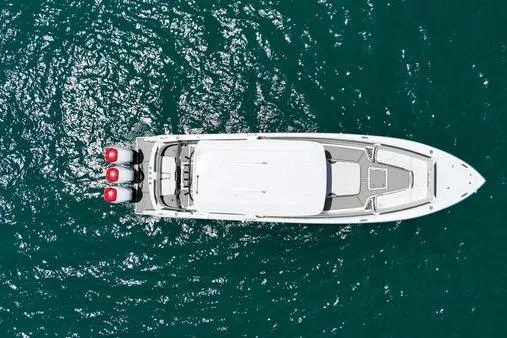 Slide: The Image of Overhead view of 2019 Nor-Teck 390 Sport Center Console boat on blue water. - 2