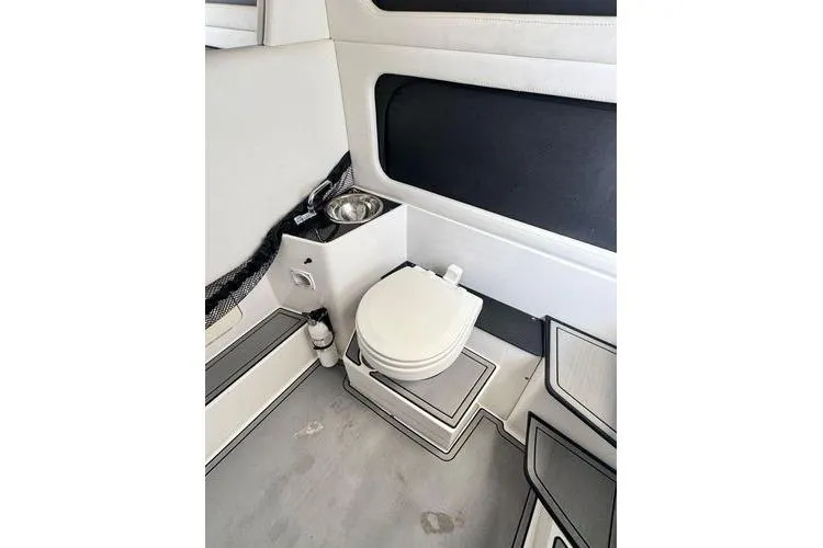 Slide: The Image of 2019 Nor-Teck 390 Sport Center Console interior with toilet and sink. - 20