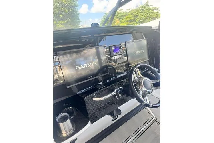 Slide: The Image of 2019 Nor-Teck 390 Sport Center Console with Garmin displays and sleek steering wheel. - 22