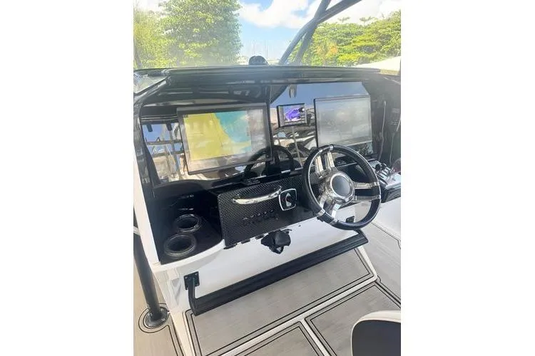 Slide: The Image of 2019 Nor-Teck 390 Sport Center Console dashboard with modern navigation displays. - 24