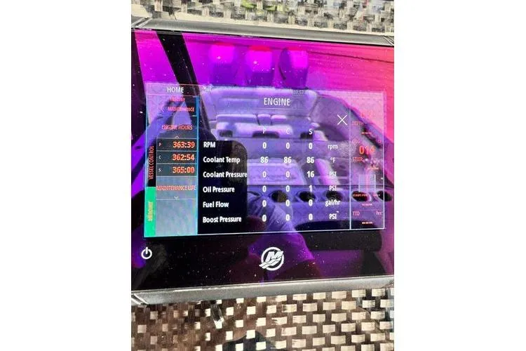 Slide: The Image of Dashboard of 2019 Nor-Teck 390 Sport Center Console displaying engine metrics. - 25