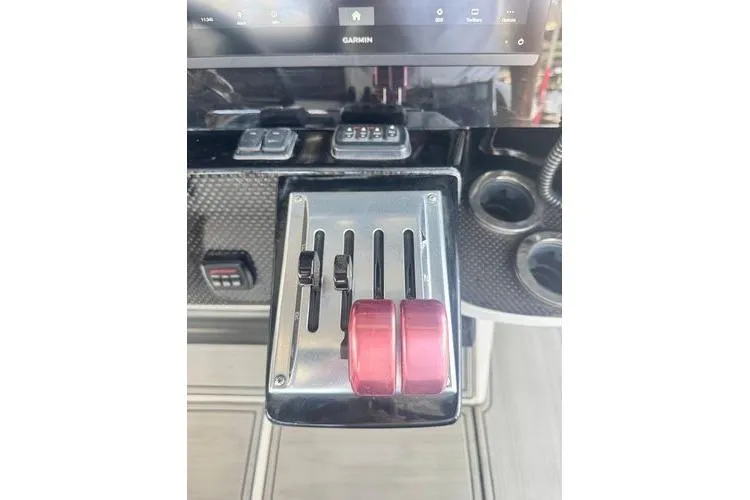 Slide: The Image of Control panel of 2019 Nor-Teck 390 Sport Center Console boat with throttle levers. - 26