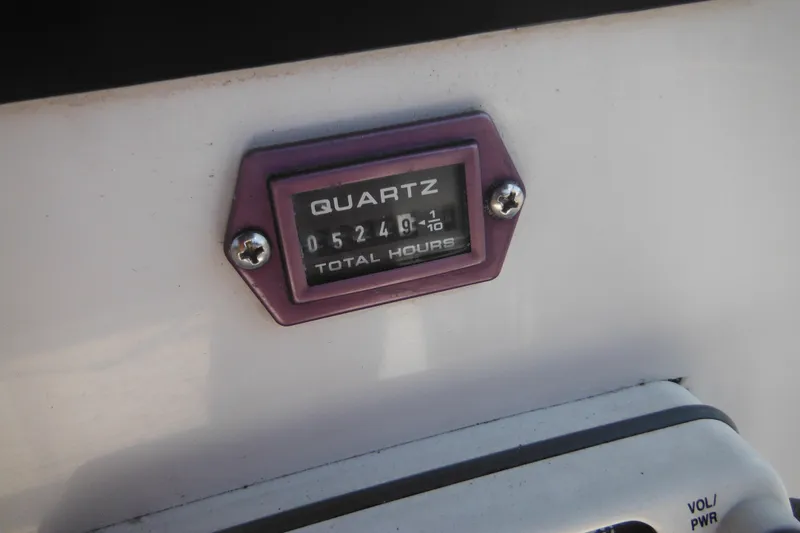 Slide: The Image of Hour meter on 1996 Boston Whaler Outrage 17 showing 524.9 total hours. - 10