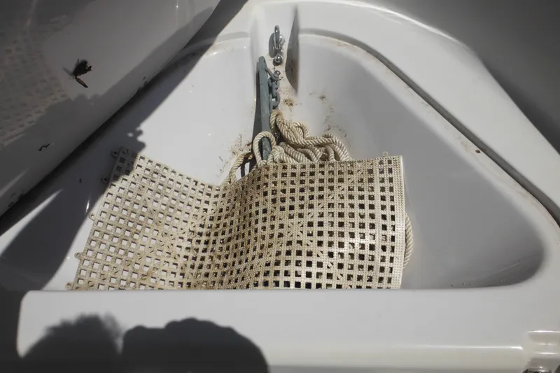 Slide: The Image of Anchor storage area on a 1996 Boston Whaler Outrage 17 boat. - 18