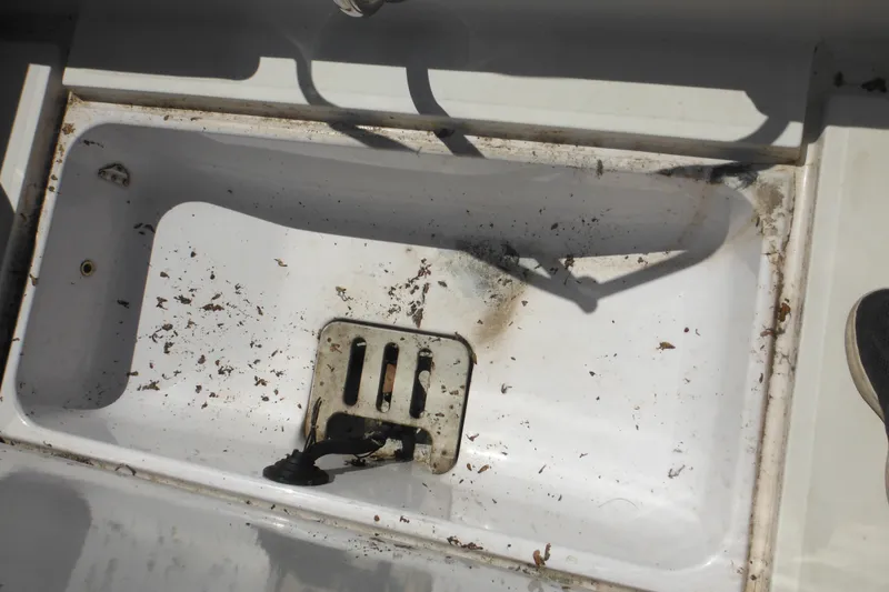 Slide: The Image of Dirty compartment of a 1996 Boston Whaler Outrage 17 boat. - 27