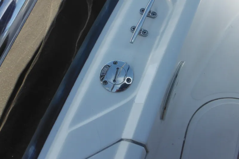 Slide: The Image of 1996 Boston Whaler Outrage 17 boat deck with chrome fittings and cleat. - 32