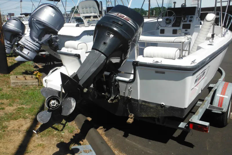 Slide: The Image of 1996 Boston Whaler Outrage 17 boat with Yamaha outboard motor on trailer. - 4