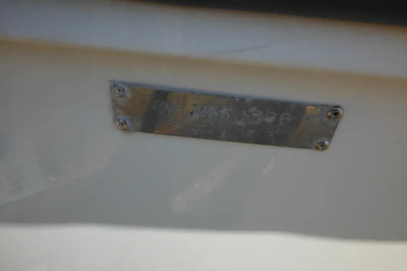Slide: The Image of Metal identification plate on a 1996 Boston Whaler Outrage 17 boat hull. - 6