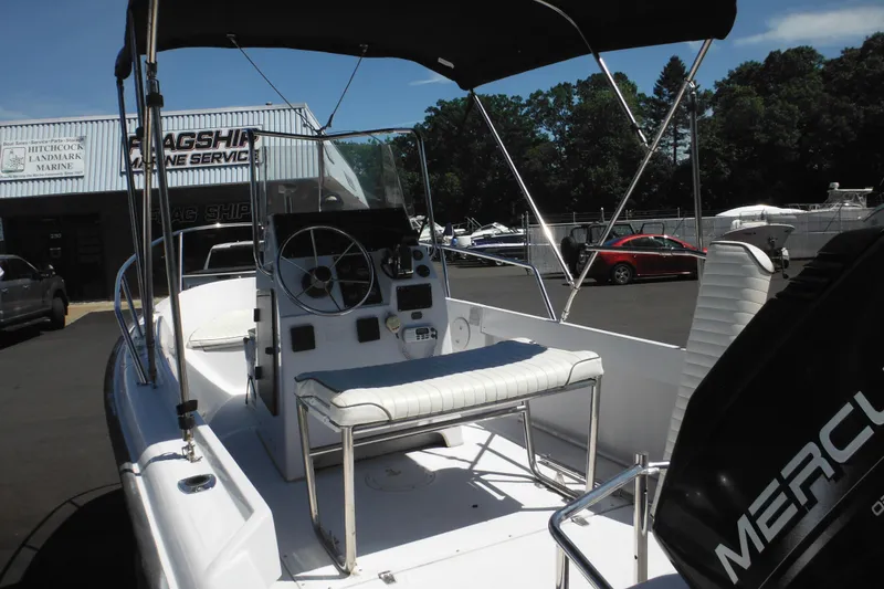 Slide: The Image of 1996 Boston Whaler Outrage 17 boat with Mercury engine at marine service center. - 7