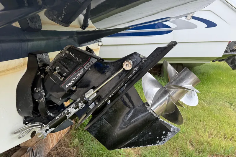 Slide: The Image of 2008 Rinker 260 Express Cruiser with MerCruiser Bravo Three outdrive, showing dual propellers. - 11