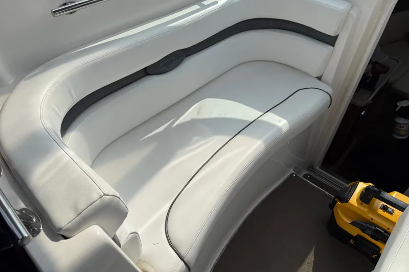 Slide: The Image of White seating area on a 2008 Rinker 260 Express Cruiser boat interior. - 5