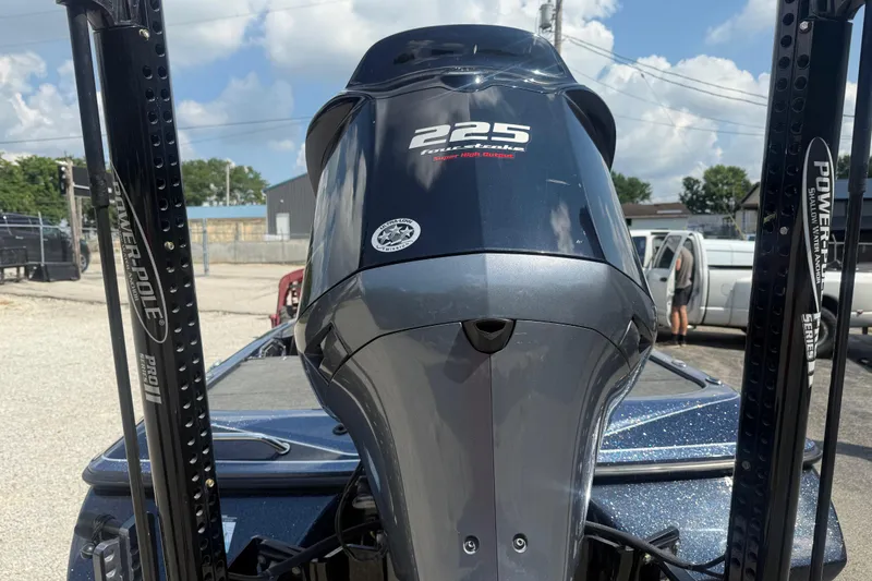 Slide: The Image of 2020 Skeeter ZX225 boat engine with Power-Pole anchors in a parking lot. - 6
