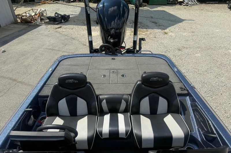 Slide: The Image of 2020 Skeeter ZX225 boat interior with dual seats and steering wheel. - 9