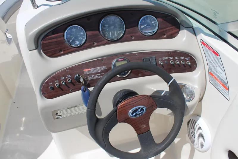 Slide: The Image of Steering console of 2006 Sea Ray 270 Sundeck with gauges and controls. - 16