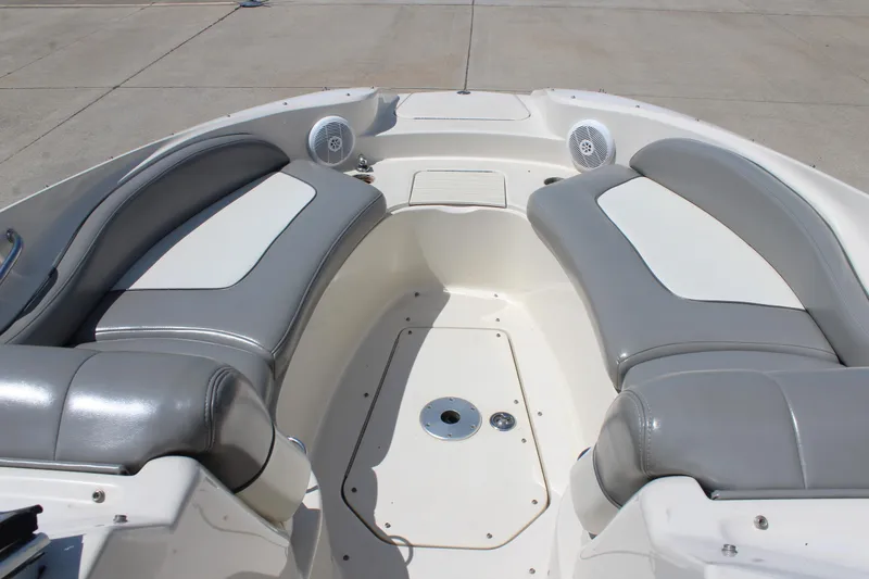 Slide: The Image of 2006 Sea Ray 270 Sundeck interior with gray and white seating, showcasing spacious design. - 20