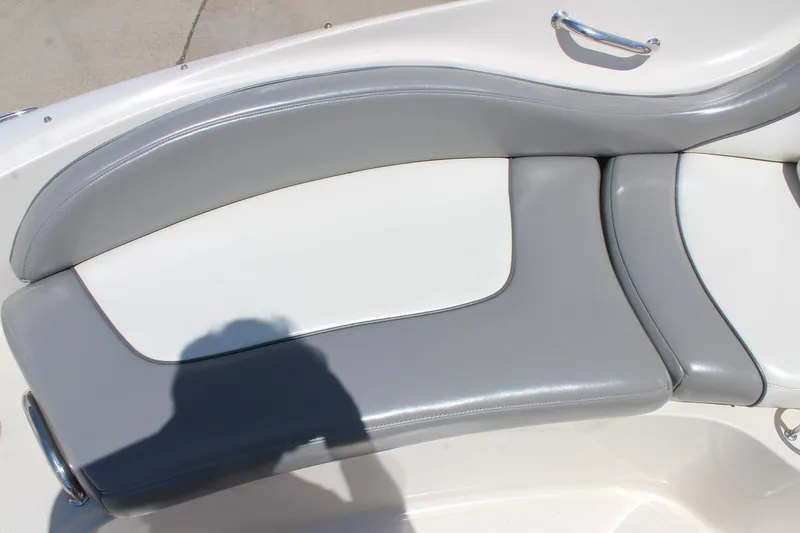 Slide: The Image of Gray and white seating on a 2006 Sea Ray 270 Sundeck boat. - 23