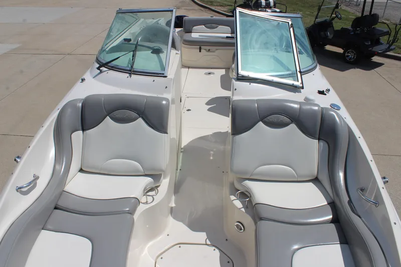 Slide: The Image of 2006 Sea Ray 270 Sundeck boat interior with gray and white seating. - 26