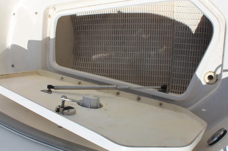 Slide: The Image of Open storage compartment on a 2006 Sea Ray 270 Sundeck boat. - 27