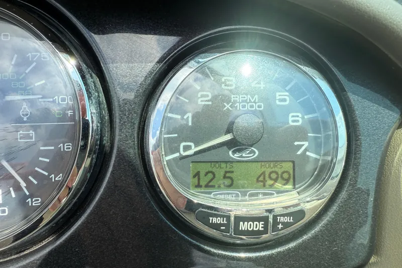 Slide: The Image of Close-up of 2004 Sea Ray 200 Select boat dashboard, showing RPM and hours. - 17