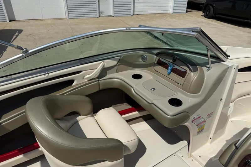 Slide: The Image of 2004 Sea Ray 200 Select boat interior with seating and dashboard view. - 18